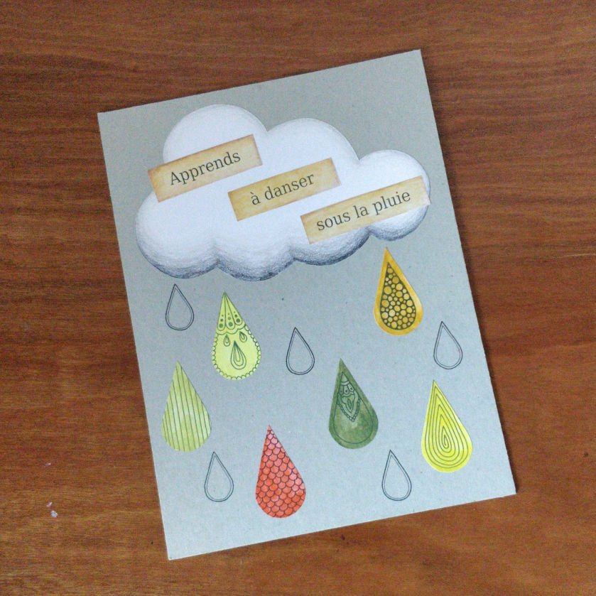 Réalisation automnale en mixed media sur carton représentant un nuage avec des gouttes de pluie colorées